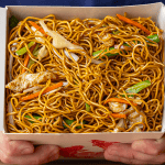 Chinese takeout chow mein with charred egg noodles and stir-fried chicken