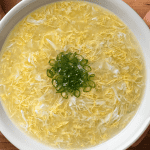 chinese takeout egg drop soup with wispy egg ribbons and sliced green onion