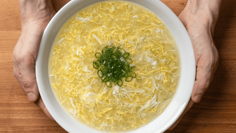 chinese takeout egg drop soup with wispy egg ribbons and sliced green onion