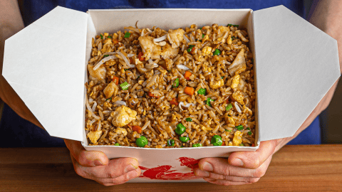 Chinese takeout fried rice with chicken, egg, and vegetables