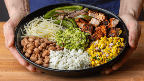 chipotle burrito bowl with adobo chicken cilantro lime rice pinto beans and guacamole
