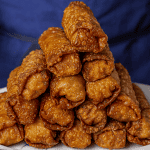 crispy double-fried chinese takeout egg rolls with blistered golden skin