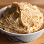 Benihana garlic butter in a small bowl showing garlic and soy sauce mixed into softened butter