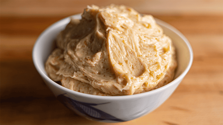 Benihana garlic butter in a small bowl showing garlic and soy sauce mixed into softened butter