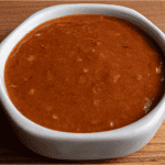 Benihana spicy sauce in a small bowl with sriracha sambal oelek and chili oil