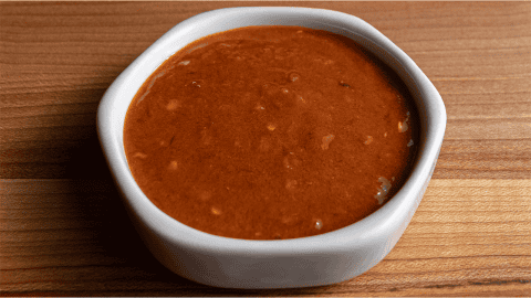 Benihana spicy sauce in a small bowl with sriracha sambal oelek and chili oil