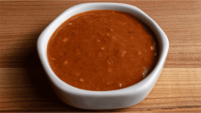 Benihana spicy sauce in a small bowl with sriracha sambal oelek and chili oil
