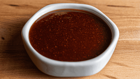 Benihana spicy teriyaki sauce in bowl with visible red pepper flecks