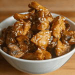 Benihana teriyaki chicken with sesame seeds on a white plate