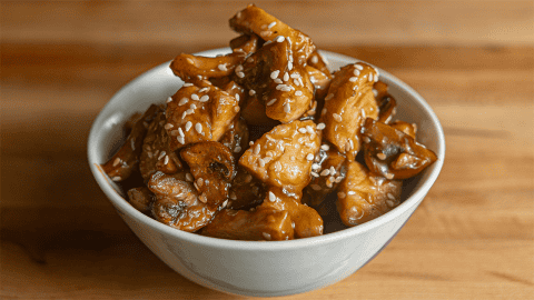 Benihana teriyaki chicken with sesame seeds on a white plate