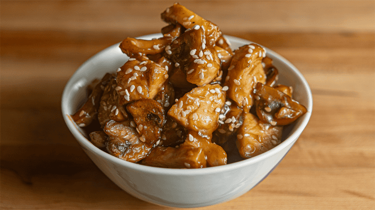 Benihana teriyaki chicken with sesame seeds on a white plate