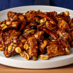P.F. Chang's Kung Pao Chicken with peanuts dried red chilis and celery in a bowl