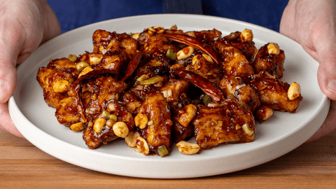 P.F. Chang's Kung Pao Chicken with peanuts dried red chilis and celery in a bowl