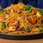 P.F. Chang's Singapore Street Noodles with curry sauce chicken and shrimp garnished with fried shallots