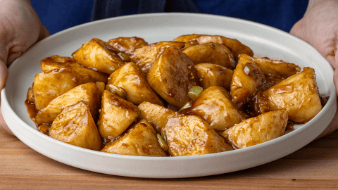 P.F. Chang's stir-fried eggplant with glossy sauce on a plate